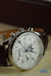 Longines Master Collection Moon Phase: Unboxing Review [L2.673.4.78.3] On side with crown side up in low light with dial illuminated