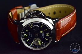 Unboxing Review: Panerai Luminor GMT 44mm [PAM00088] Luminor sitting on its side in low light with the lume glowing slightly