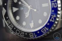 Review of the Rolex GMT Master II [116710BLNR] aka ‘The Batman’ Close up of the GMT's bezel and dial in low light