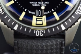Oris Divers Sixty-Five closeup of bottom half of dial with the date window, 6 o’clock marker, bezel, lugs, strap and WATER RESISTANT 10 Bar markings [01 733 7707 4064-07 4 20 18]