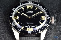 Oris Divers Sixty-Five closeup sitting on black leather [01 733 7707 4064-07 4 20 18]