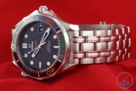 Omega Rio 2016 Olympic Limited Edition Seamaster Diver 300m: Hands On Review [522.30.41.20.01.001] - On a red background facing the left