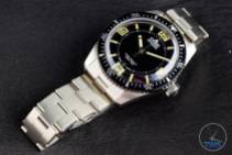 The Oris Divers Sixty-Five (With Metal Bracelet) [01 733 7707 4064-07 8 20 18] Face Up Laying on Bracelet
