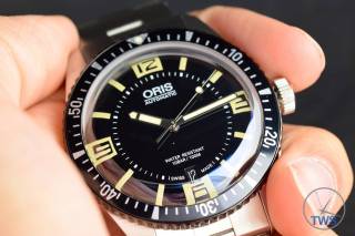 The Oris Divers Sixty-Five (With Metal Bracelet) [01 733 7707 4064-07 8 20 18] Sat In Hand With Black Background